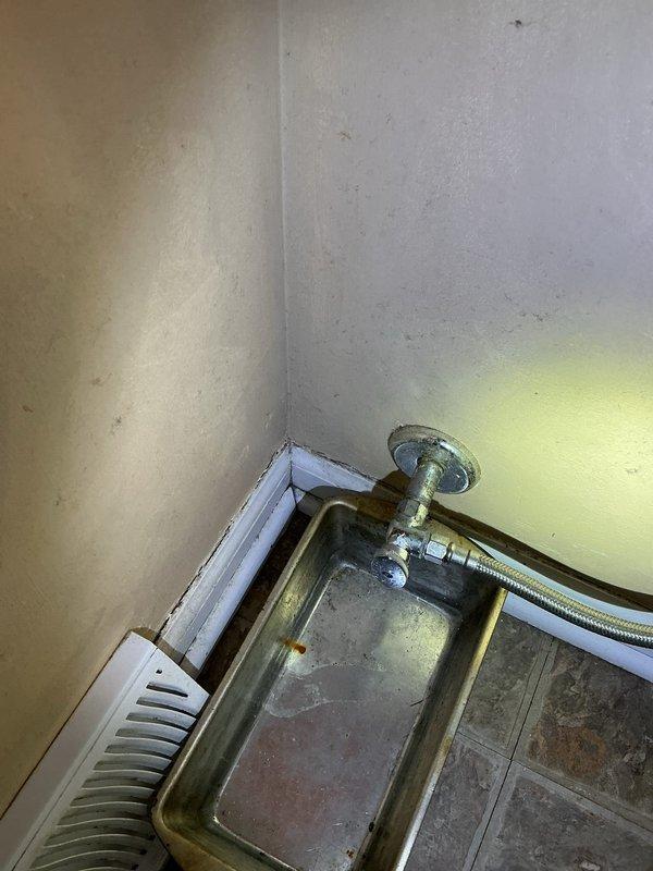 Replaced leaking toilet supply valve at primary location with new quarter-turn valve to eliminate stem leak. Installed additional supply valves on two secondary toilets as preventative measure. Removed old garbage disposal and installed customer-provided replacement unit, confirming proper operation and absence of leaks.