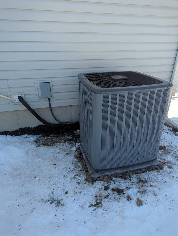 Successfully completed comprehensive HVAC system upgrade, installing new furnace, AC unit, and water heater. The installation included proper mounting of the outdoor condenser unit on a concrete pad with appropriate refrigerant line connections, and complete setup of the water heating system with associated filtration components including a water softener and brine tank, all properly plumbed with copper piping and brass valves.