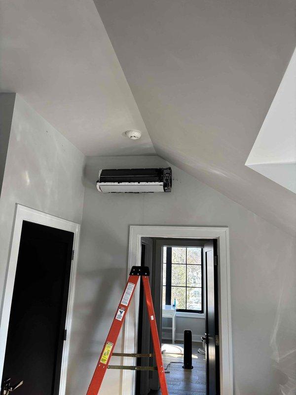 Responded to NH service call for mini-split system with ongoing operational issues. Performed diagnostic inspection of refrigerant lines and service ports, noting signs of minor corrosion around valve fittings. Evaluated indoor unit installation and assessed overall system condition to determine appropriate repair solution after previous contractor communication issues.