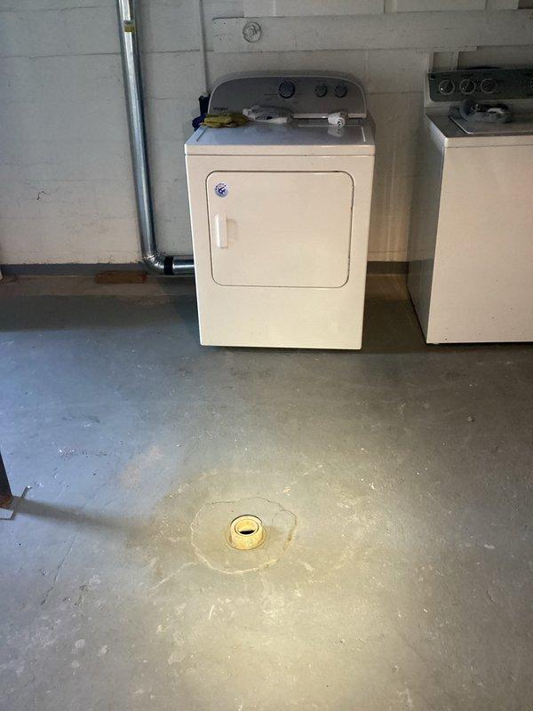 Responded to emergency call for sewage backup caused by failed lift pump. Completed inspection of basement drainage system, including concrete utility sink and floor drains showing previous water damage. Capped exposed pipe in basement as requested and verified proper operation of sump pump system near laundry area to prevent future backups.