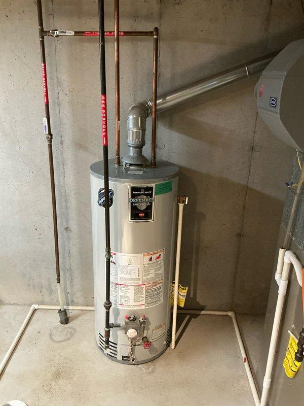 Performed complimentary furnace tune-up on 21-year-old Carrier system with failed heat exchanger. Documented water heater installation and electrical panel for replacement estimate. Customer notified of critical safety issue requiring system replacement.