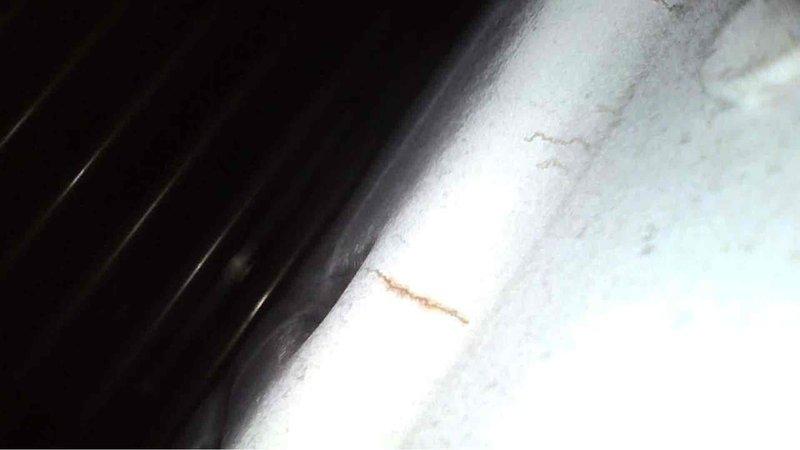 Responded to no heat call for a 14-year-old Carrier furnace. Upon inspection, found heat exchanger with significant rust and cracking, indicating failure. Advised customer of safety concerns and shut down unit to prevent carbon monoxide risks.