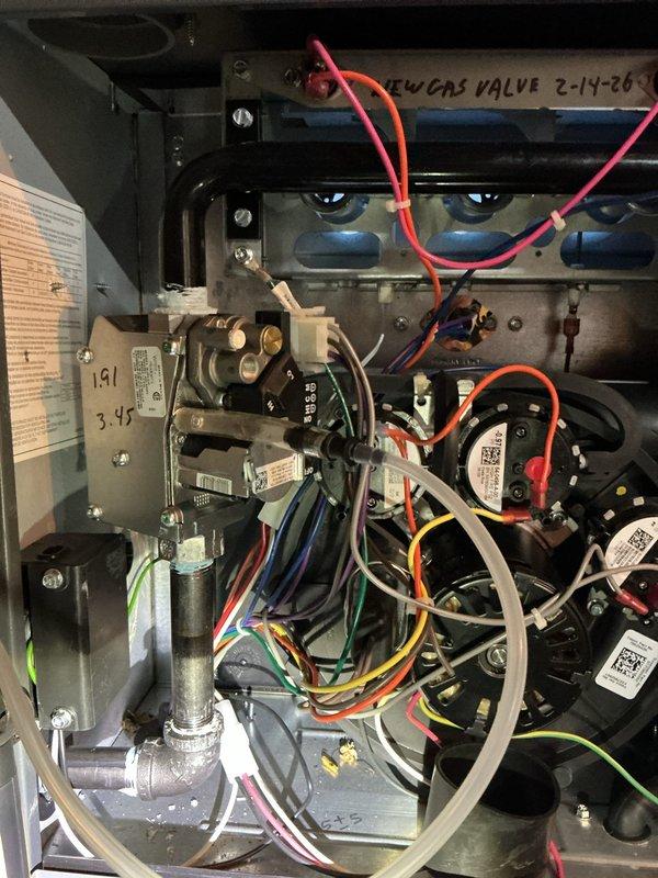 Responded to no heat call with indoor temperature at 45°F despite thermostat set to 68°F. Diagnosed faulty gas valve on 2-year-old Energi water heater (warranty valid until 09/2033) and replaced component. System now operating properly with heat restored to residence.