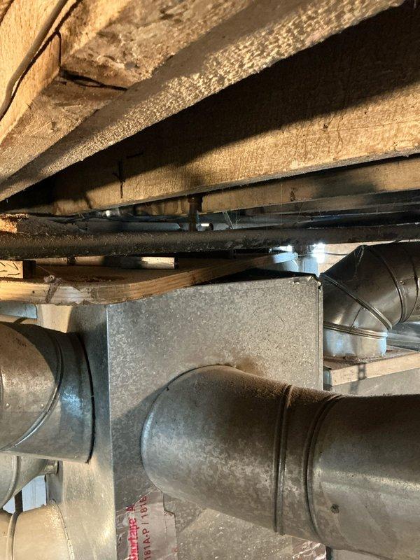 Diagnosed 25+ year old furnace with limit switch failure as indicated by blinking HTX status light. Inspected aging system components including heat exchanger, ductwork connections, and drainage system in basement installation. Recommended replacement due to unit's advanced age, visible wear, and repair cost considerations versus efficiency benefits of modern equipment.