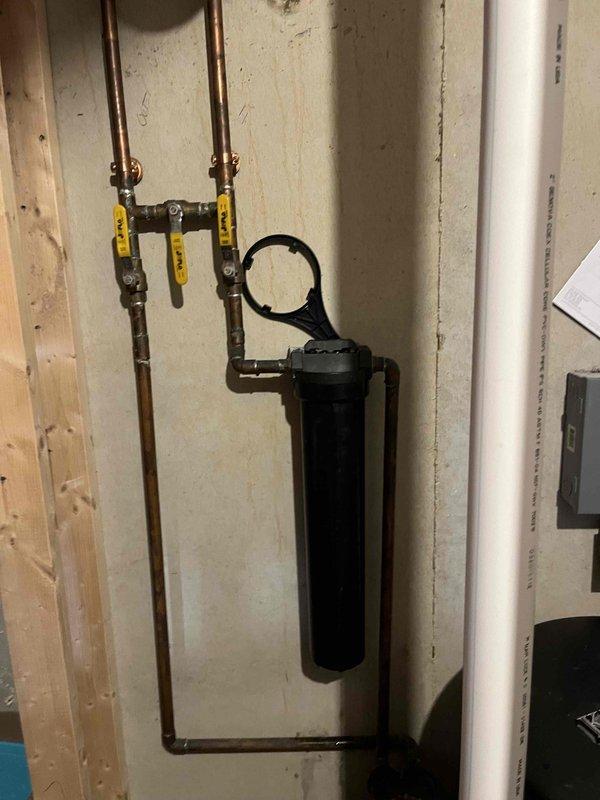 Successfully completed the replacement of condensation resin beads in the Navien tankless water heater system. Serviced the filtration assembly connected to copper supply lines and PVC drainage components, ensuring proper installation and functionality. System is now operating at optimal efficiency with the new resin media in place.