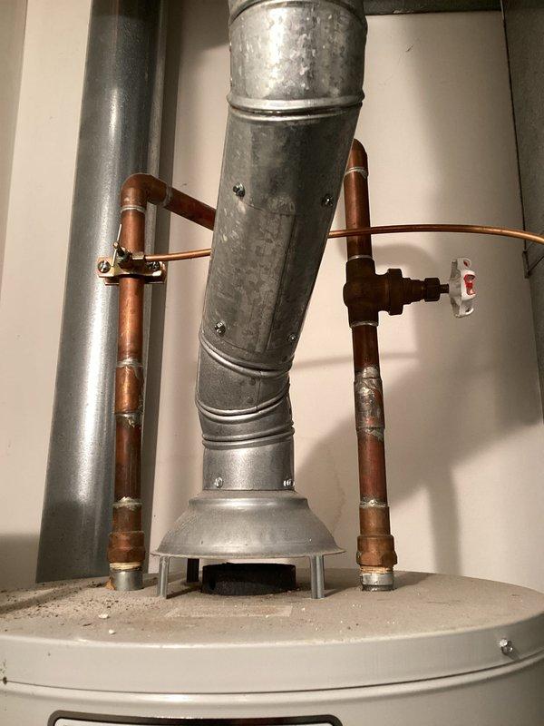 Replaced a corroded water heater valve during scheduled service call. Performed comprehensive inspection of the entire water heater system including copper supply lines, galvanized vent pipe, and associated fittings. All components now functioning properly with no leaks detected.