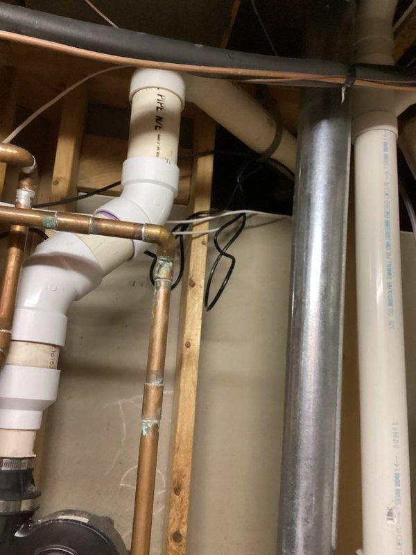 Diagnosed 9-year-old water heater with active leak at tank base and no hot water output. Customer had correctly shut off water supply and power to unit prior to arrival. Confirmed tank failure requiring full replacement due to age and deterioration visible at bottom of tank.