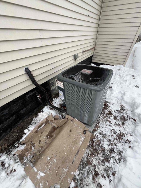 Successfully installed new furnace and air conditioning system. Properly mounted outdoor condenser unit on concrete pad with all necessary electrical connections and refrigerant lines secured to exterior wall. System installation completed and verified operational with customer approval obtained.