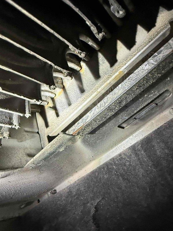 Diagnosed 19-year-old furnace system with heavily dust-contaminated evaporator coils affecting system efficiency. Performed thorough cleaning of blower assembly and evaporator coils to restore proper airflow and heat exchange capacity.