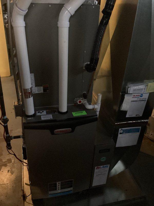 Completed annual heating visit on 4-year-old Lennox furnace. Performed standard tune-up with comprehensive system check. Took photos documenting both the wall-mounted mini-split unit and basement-installed furnace with PVC exhaust/intake pipes. System is functioning properly with no humidity issues identified.
