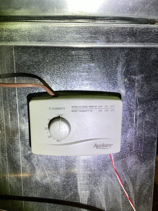 Completed annual heating visit on 10-year-old furnace and humidifier system. Inspected and adjusted the Aprilaire humidity control unit, ensuring proper calibration of the percentage settings. Checked the seasonal adjustment valve, confirming correct positioning between summer and winter modes.