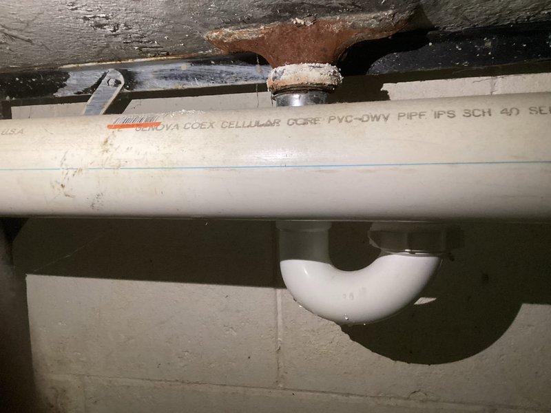 Performed a comprehensive water heater tune-up, including a complete system flush to remove sediment buildup. Inspected aging PVC plumbing components showing signs of discoloration and identified corrosion at metal connection points near the ceiling. System is now operating efficiently with improved drainage through the cellular core PVC-DWV piping.