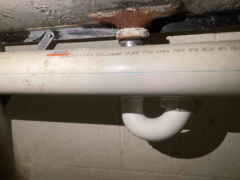 Performed a comprehensive water heater tune-up, including a complete system flush to remove sediment buildup. Inspected aging PVC plumbing components showing signs of discoloration and identified corrosion at metal connection points near the ceiling. System is now operating efficiently with improved drainage through the cellular core PVC-DWV piping.