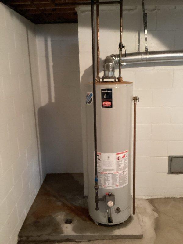Completed annual heating system maintenance and humidifier tune-up on 7-year Energy Wise equipment (warranty through 9-2028). Inspected ventilation ducting and water heater, noting proper installation of exhaust piping and confirming all connections are secure. Documentation completed with photographic evidence of system components.