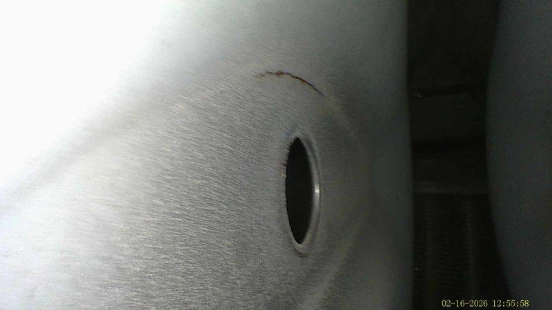 Responded to water leak issue with whole-house Aprilaire humidifier connected to furnace. Inspection revealed damaged metal ductwork with multiple tears and rips causing significant water leakage. Identified small hole in metal surface that contributed to the problem.