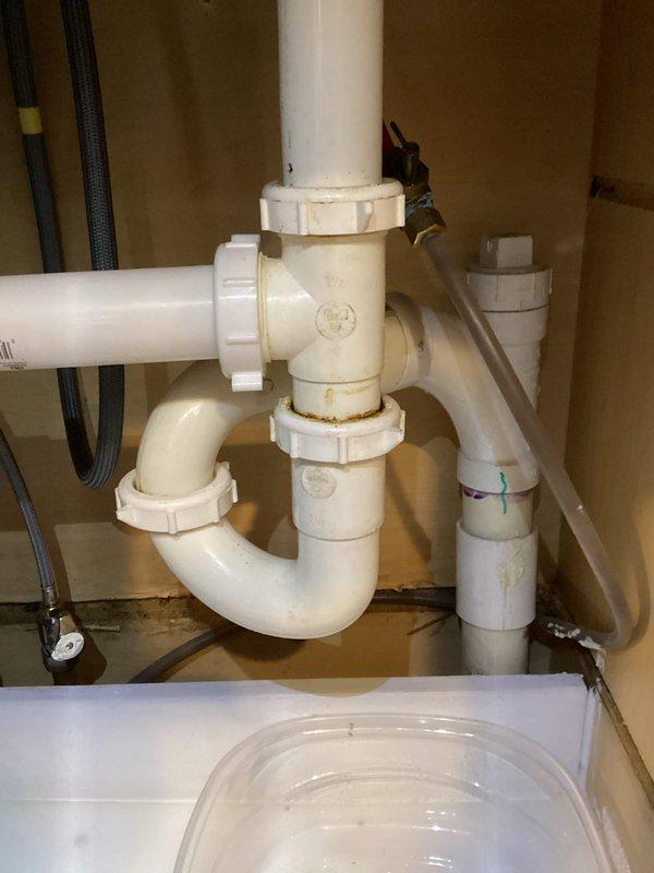 Responded to service call for a leaking sink following installation. Inspected the PVC drainage system and P-trap assembly, identifying loose fittings at connection points. Tightened all threaded connections and unions, verified proper alignment of the P-trap, and tested drainage system. Confirmed leak was resolved with no further issues.