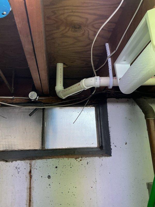 Completed quoted kitchen drain line repair involving PVC pipe system. Serviced P-trap configuration under sink cabinet and addressed connecting drain components in basement/utility area where drain line connects to main waste stack. Verified proper drainage and functionality of all repaired components.