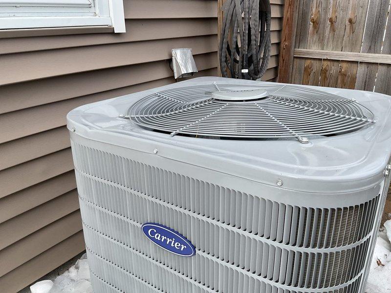 Responded to service call for a Carrier WT-8-2034 outdoor condensing unit (2 years old) that sustained damage from ice falling off the roof. Performed visual inspection of the unit, which appears externally intact with no immediately visible damage to the cabinet, fan assembly, or refrigerant lines. Recommended further diagnostic testing to assess potential internal damage to compressor or electrical components.