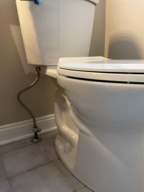 Successfully completed comfort height elongated toilet replacement in bathroom. Removed existing standard toilet and installed new comfort height model with proper water supply connection. Verified proper functioning and no leaks upon completion.