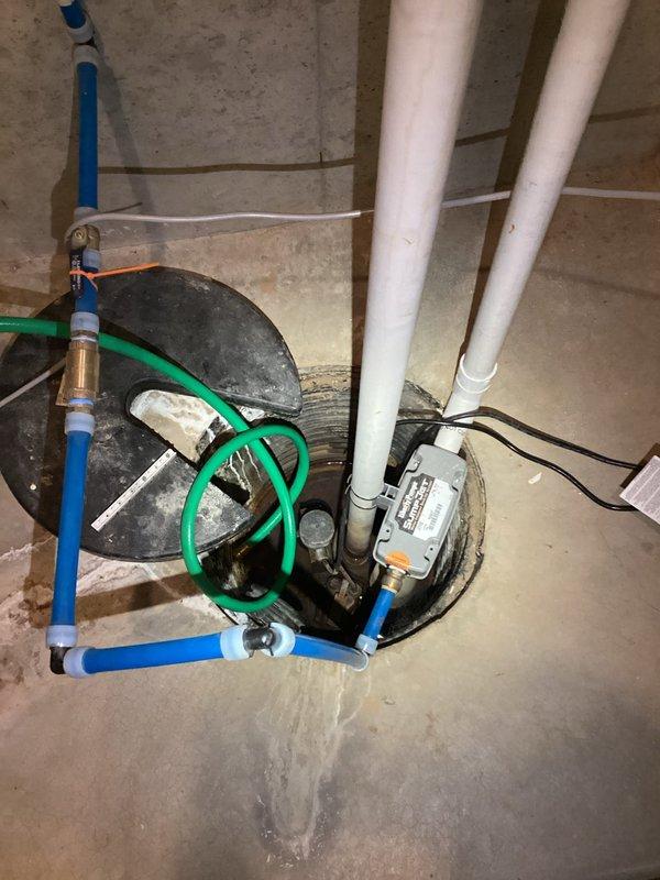 Replaced failing sump pump with new high-capacity model in home located in wetlands area prone to flooding. Installed upgraded pump controller and verified proper operation of complete discharge system including PVC piping and check valve. System now functioning optimally to prevent basement flooding during heavy precipitation events.
