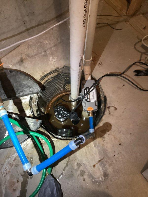 Replaced failing sump pump with new high-capacity model in home located in wetlands area prone to flooding. Installed upgraded pump controller and verified proper operation of complete discharge system including PVC piping and check valve. System now functioning optimally to prevent basement flooding during heavy precipitation events.