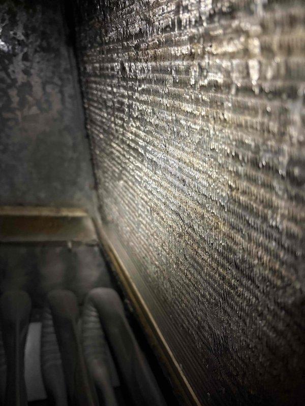 Responded to service call for furnace not cycling without manual reset. Upon inspection, identified excessive moisture on evaporator coil causing system malfunction. Cleaned condensate drainage system, verified proper operation after service, and explained manufacturer warranty details to customer regarding parts and labor coverage.