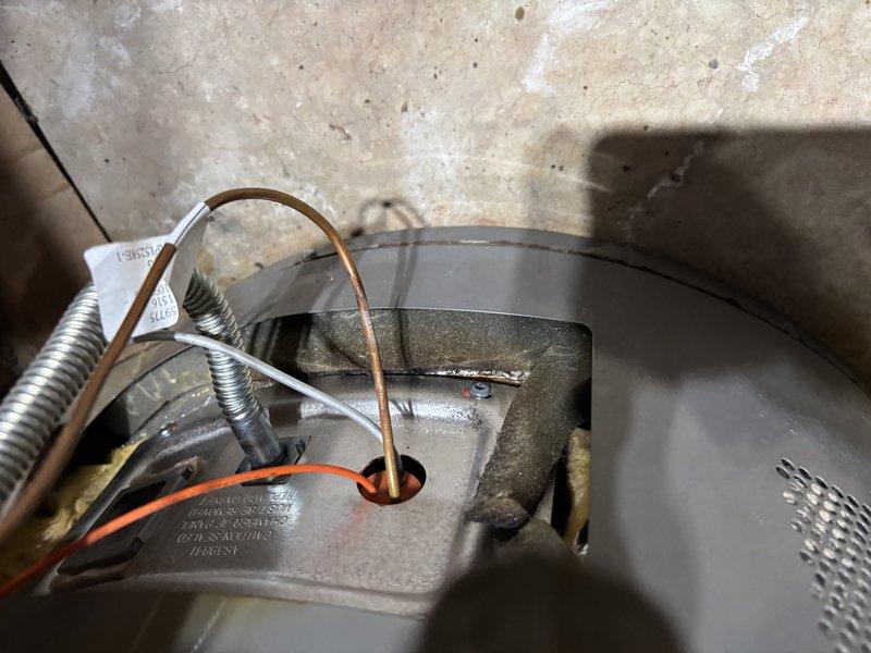Responded to service call for non-heating water heater with pilot light failure. Diagnosed faulty thermocouple and replaced component to restore proper ignition. System now functioning normally with stable pilot flame and proper heating operation.