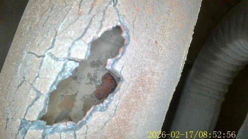 Completed FSTU on 19-year-old Goodman furnace, discovering significant structural damage to surrounding wall material and severe corrosion with visible cracking on the exhaust piping. Documented conditions with photos and recommended immediate repairs to address safety concerns related to the deteriorated vent pipe and damaged wall structure.