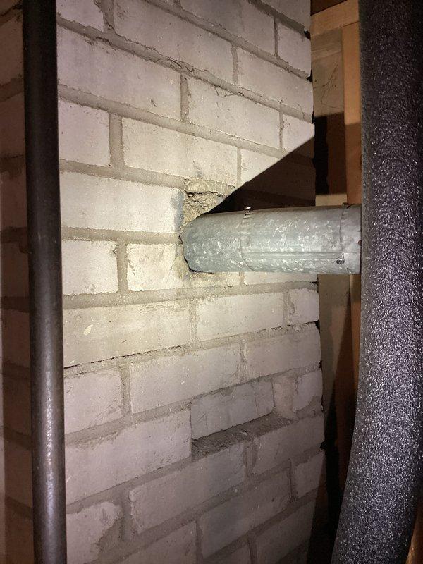 Conducted assessment of 16-year-old water heater that failed to operate. Diagnosed multiple issues including pilot light failure and evidence of leakage into catch basin. After thorough inspection of gas valve assembly, tankless components, and ventilation system through brick wall, determined unit requires replacement due to age and deteriorating condition.