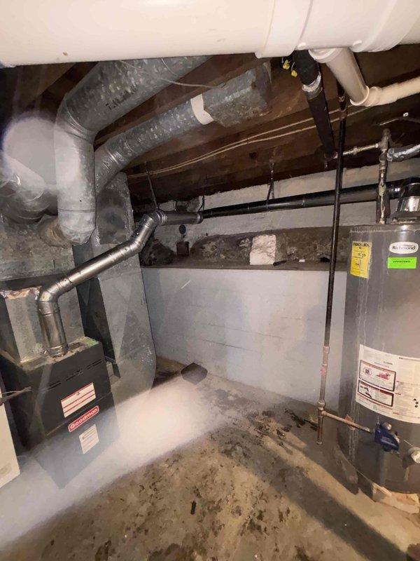 Completed installation of new chimney liner in residential basement mechanical room. Properly secured all metal ductwork connections with appropriate metal straps and tape, ensuring proper ventilation for the existing water heater and furnace system. Verified complete system functionality and documented installation with comprehensive photos of the mechanical area, including all connected HVAC and venting components.