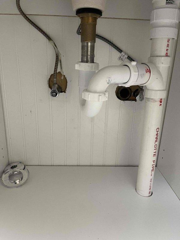 Successfully completed quoted repair involving floor penetration to install new PVC drain pipe for vanity. Connected new drainage system to the existing main stack, which included proper P-trap installation with appropriate fittings. Work was performed in confined underfloor space requiring specialized access techniques.