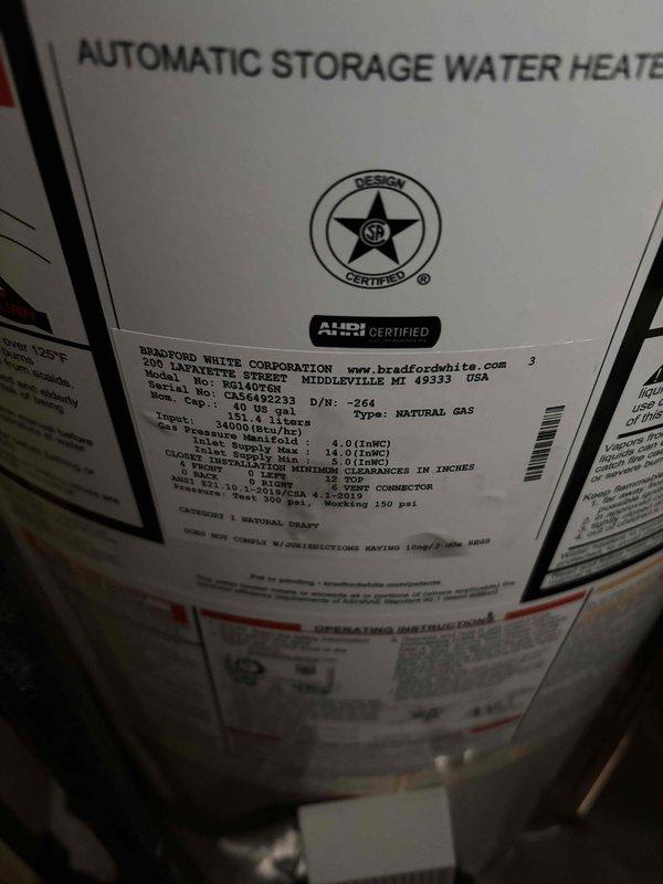 Successfully installed a 40-gallon Bradford White automatic storage water heater with natural gas connection. Completed all necessary piping connections including copper lines with brass fittings and proper ductwork integration. Installation included mounting of expansion tank and ensuring all clearances and pressure specifications were met according to manufacturer requirements.