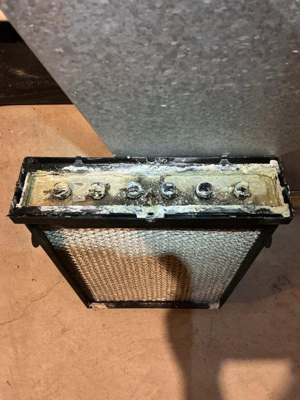 Performed annual heating maintenance on two furnaces and humidifier. Found severely clogged humidifier filter with significant mineral buildup and dust accumulation. Cleaned and serviced evaporator coil which showed extensive dirt contamination that was restricting proper system operation. Both components showed signs of neglected maintenance that could impact system efficiency and air quality.