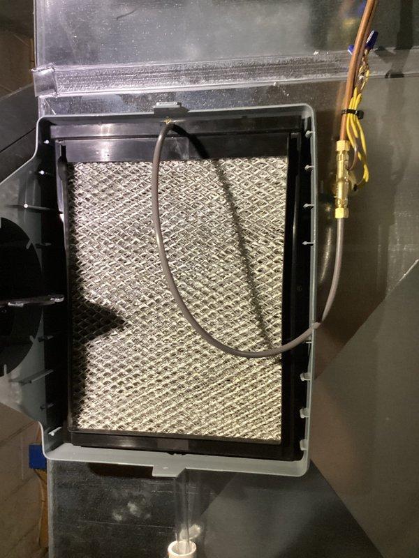 Performed annual heating tune-up on 1-year-old EnergiAir furnace (Model WT 09-2034, manufactured 2018). Inspected filter assembly and interior components, verified proper installation of diamond mesh filter in housing, and examined wiring connections. System functioning normally with no issues identified.
