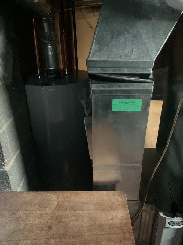 Performed annual furnace tune-up maintenance service on existing system located in utility area. Inspected furnace unit with attached ductwork and verified proper installation and operation. No issues or anomalies were identified during the comprehensive examination.