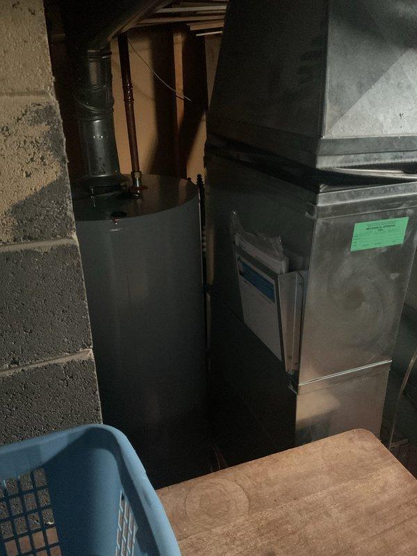 Performed annual furnace tune-up maintenance service on existing system located in utility area. Inspected furnace unit with attached ductwork and verified proper installation and operation. No issues or anomalies were identified during the comprehensive examination.