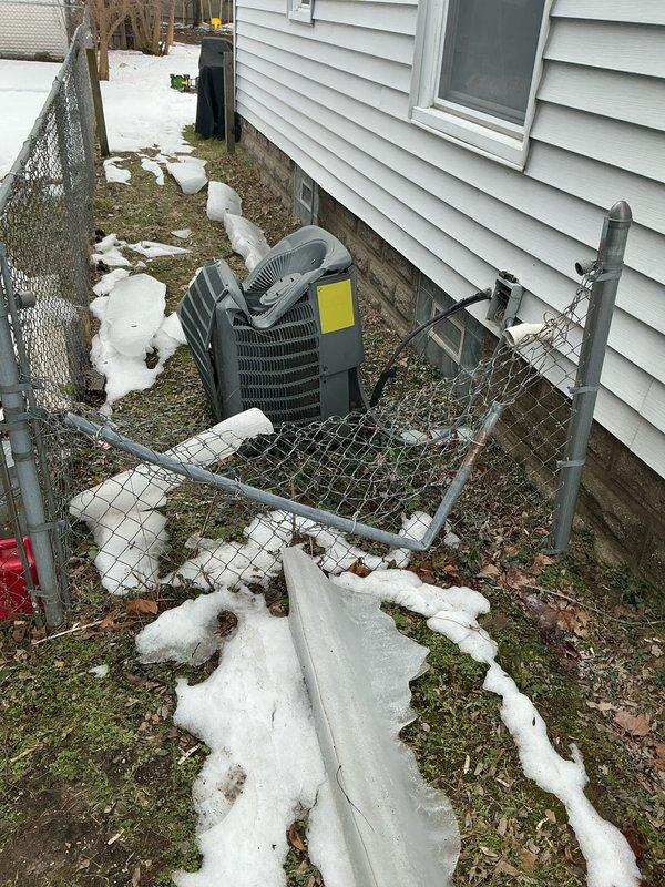 Conducted comprehensive estimate for replacement of 16-year-old AC system. Inspected both the indoor air handler located in basement utility room and outdoor condensing unit positioned within fenced enclosure adjacent to house. Documented current system condition with photographs for assessment purposes.