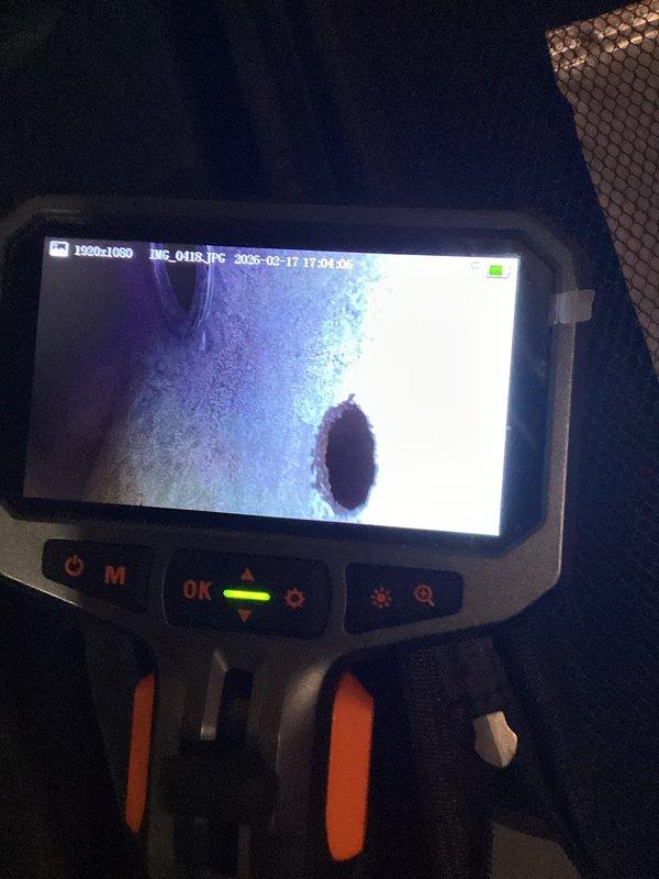 Responded to customer-reported burning odor with suspected motor failure in approximately 10-year-old unit. Performed thorough inspection using borescope camera to examine internal components and utilized Bacharach gas analyzer which detected minimal CO levels (2 ppm) with normal oxygen readings (20.8%), confirming no significant gas leak. Determined source of odor and addressed the issue.