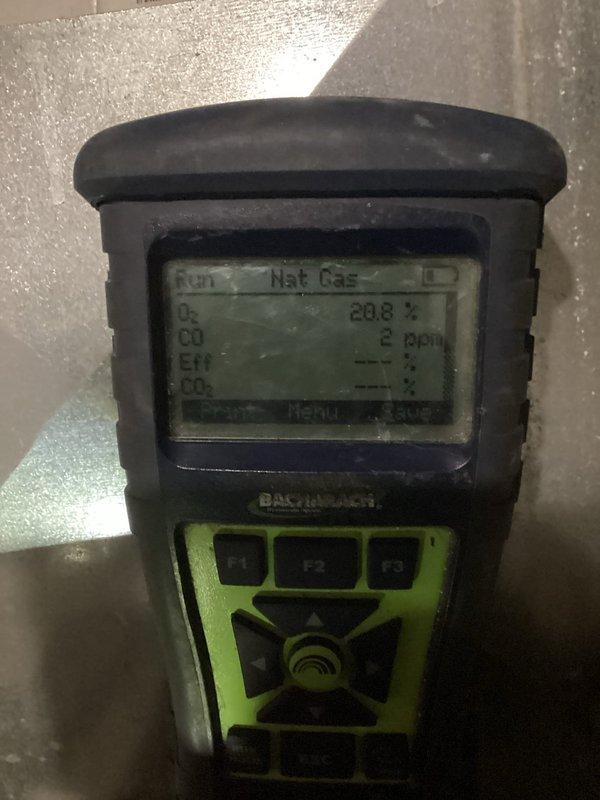 Responded to customer-reported burning odor with suspected motor failure in approximately 10-year-old unit. Performed thorough inspection using borescope camera to examine internal components and utilized Bacharach gas analyzer which detected minimal CO levels (2 ppm) with normal oxygen readings (20.8%), confirming no significant gas leak. Determined source of odor and addressed the issue.
