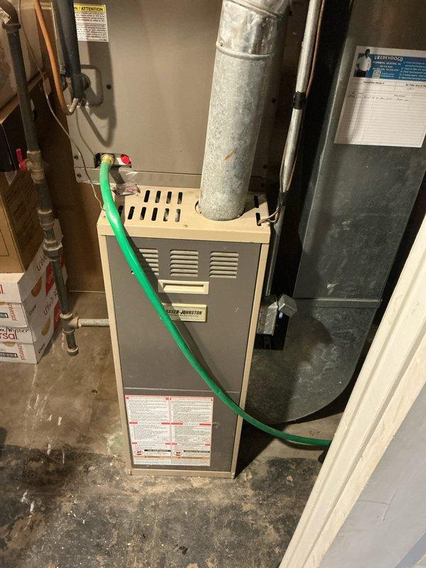 Completed furnace estimate for customer inquiring about 90% efficiency furnace with humidifier. Inspected existing 16-year-old unit and documented current installation configuration including ductwork, connections, and surrounding mechanical room conditions. Photos taken of system for accurate quote preparation and equipment sizing recommendations.