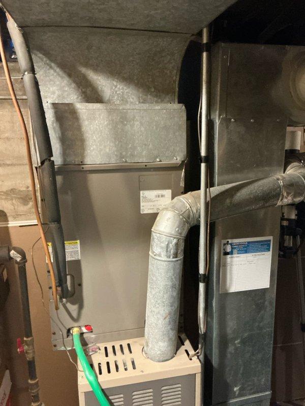 Completed furnace estimate for customer inquiring about 90% efficiency furnace with humidifier. Inspected existing 16-year-old unit and documented current installation configuration including ductwork, connections, and surrounding mechanical room conditions. Photos taken of system for accurate quote preparation and equipment sizing recommendations.