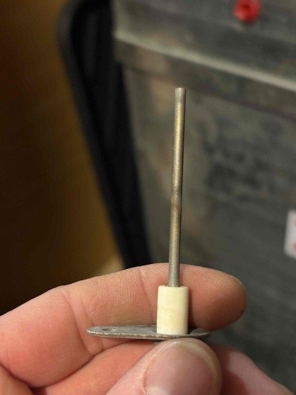 Performed annual heating tune-up on 11-year-old Goodman furnace. Removed and inspected burners showing signs of corrosion and wear. Examined ignition rod/flame sensor which appeared in good working condition. Noted customer is on service club but no humidifier is present on system.