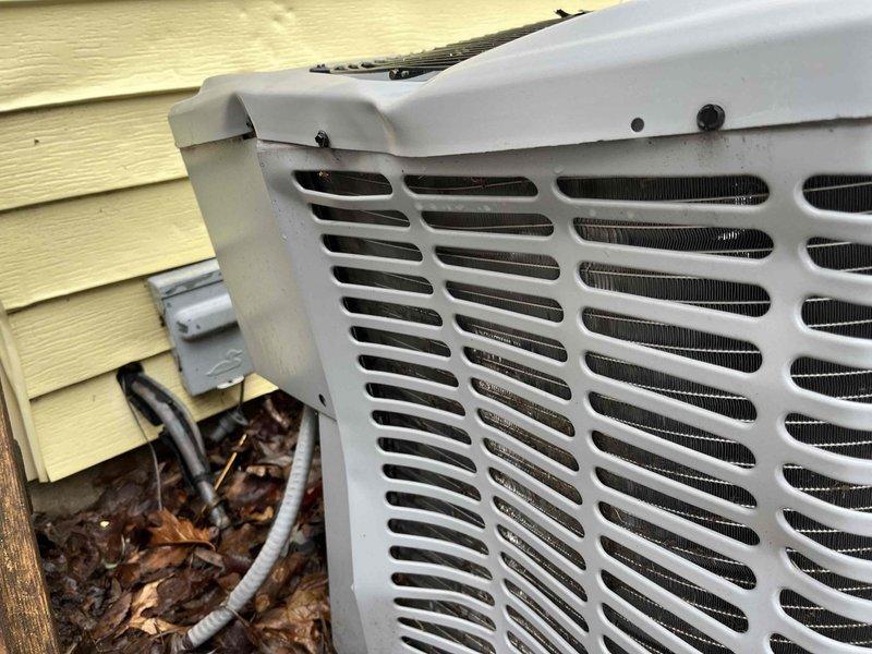 Inspected 14-year-old York outdoor condenser unit after reported ice damage. Unit appears to be in normal working condition with only minor weathering on the exterior. Determined condenser replacement is not necessary prior to upcoming furnace installation.