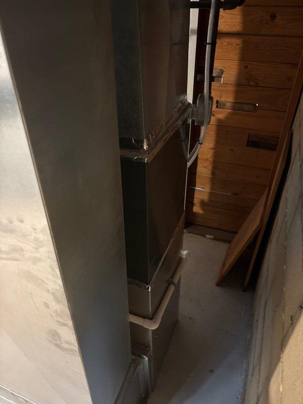 Successfully completed installation of a new Carrier furnace system with proper connection to existing ductwork and exhaust ventilation. Unit was properly secured in utility room adjacent to water heater with all manufacturer safety labels intact and visible. System was activated and verified operational with proper clearances maintained.