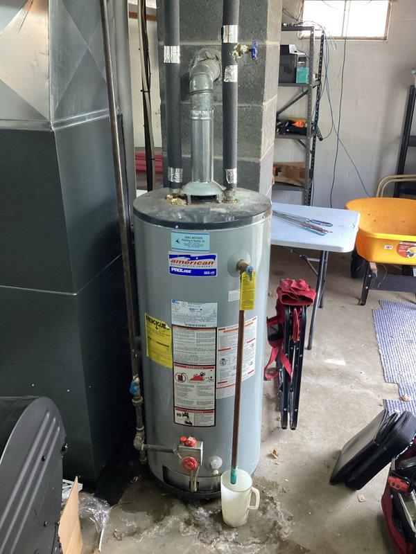 Responded to water leak complaint in basement area. Upon inspection, found water pooling under the pan of a 1-year-old ENE WT 06-2034 water heater. Identified source of leak, performed necessary repairs to stop water infiltration and ensured proper functioning of the unit.