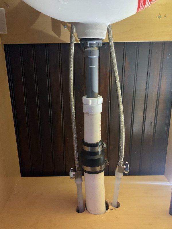 Arrived to follow up on quoted lavatory repair, but installation was postponed as client has not yet received the new fixture. Inspected existing plumbing components including PVC drain assembly and braided supply lines to ensure readiness for future installation. Will return to complete installation once client has received the new lavatory.