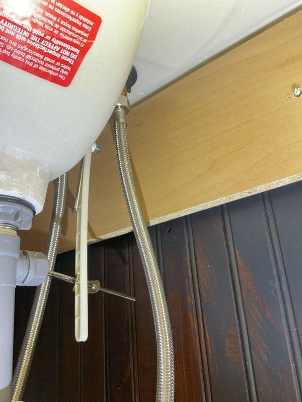 Arrived to follow up on quoted lavatory repair, but installation was postponed as client has not yet received the new fixture. Inspected existing plumbing components including PVC drain assembly and braided supply lines to ensure readiness for future installation. Will return to complete installation once client has received the new lavatory.