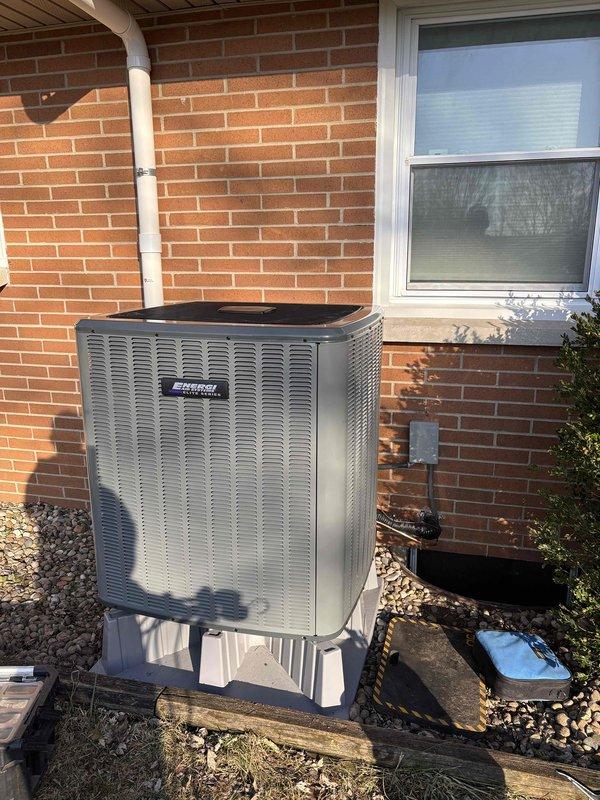 Successfully completed installation of a new MRCOOL central air conditioning system and furnace unit. The outdoor AC condenser was properly mounted on a concrete pad with wooden platform over decorative gravel, while the indoor furnace was installed with appropriate ductwork connections and PVC drainage/ventilation piping. Both units were tested and confirmed to be functioning according to manufacturer specifications.
