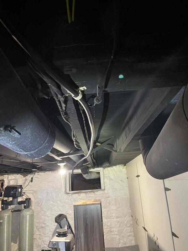 Completed relocation of laundry facilities from main floor to basement, including cutting/capping original water and drain lines and removing the old discharge sink. Installed new wash tub basin with laundry box for water supply, AAV, and heat-rated pump for discharge. Successfully extended gas lines to accommodate client's stove conversion from electric to gas and to supply the gas dryer, and installed new dryer vent penetration.