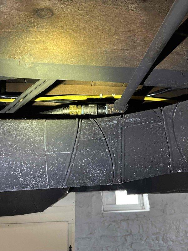 Completed relocation of laundry facilities from main floor to basement, including cutting/capping original water and drain lines and removing the old discharge sink. Installed new wash tub basin with laundry box for water supply, AAV, and heat-rated pump for discharge. Successfully extended gas lines to accommodate client's stove conversion from electric to gas and to supply the gas dryer, and installed new dryer vent penetration.